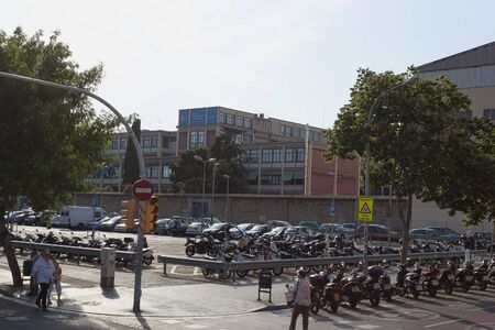 BARCELONA, SPAIN - JULY 13, 2013: On the streets of Barcelona in a summer day. In Barcelona, ââthey love to travel on scooters, so a lot of parking spaces for themのeditorial素材