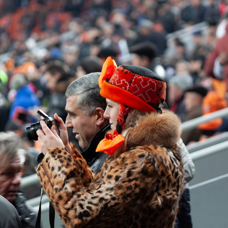 DONETSK, UKRAINE - DECEMBER 5, 2012: Shakhtar's fan with a camera in his hands at the Champions League match between Juventus and Shakhtar Donetskのeditorial素材