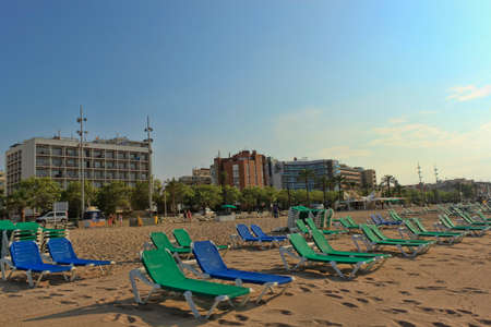 CALELLA, SPAIN - JULY 11, 2013: The beach of Calella evening on July 12, 2013. A popular holiday destination of tourists from all European countriesのeditorial素材