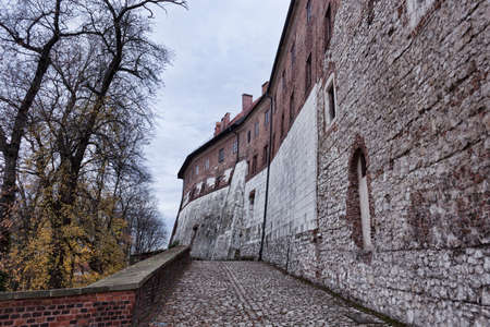 Along the walls of the Wawel Castle in Krakow. Early November, cloudy dayの写真素材