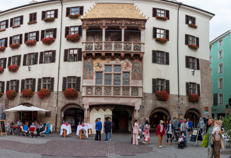INNSBRUCK, AUSTRIA - OCTOBER 14, 2023: The Golden Roof, ornamented with 2,738 fire-gilded copper tiles for Emperor Maximilian I to mark his wedding to Bianca Sforza on October 14, 2023 in Innsbruck, Austriaのeditorial素材