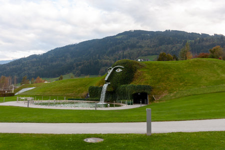 WATTENS, AUSTRIA - OCTOBER 14, 2023: Swarovski Crystal Worlds, entry under the waterfall of the head of the Giant, Wattens Tyrol, Austriaのeditorial素材