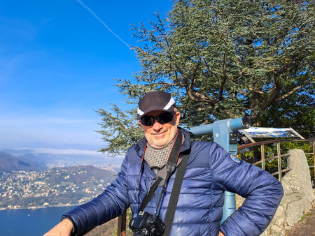 Portrait of a mature woman on the viewpoint in Brunate above Lake Como. Italy, February