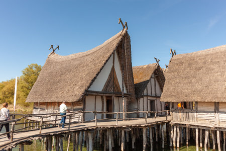 UNTERUHLDINGEN, GERMANY - APRIL 27, 2024: Stilt houses (Pfahlbauten), Stone and Bronze age dwellings in Unteruhldingen town, Lake Constance (Bodensee)のeditorial素材