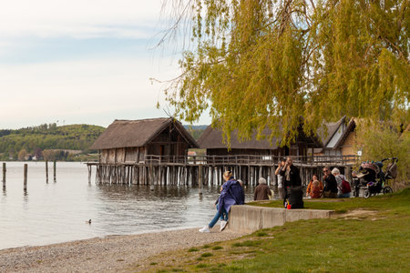 UNTERUHLDINGEN, GERMANY - APRIL 27, 2024: Near Stilt houses (Pfahlbauten), Stone and Bronze age dwellings in Unteruhldingen townのeditorial素材