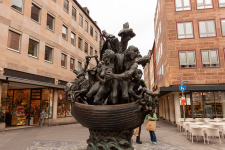 NUREMBERG, GERMANY - MAY 17, 2024: Fountain of the Ship of Fools (Narrenschiffbrunnen), sculptor JÃ¼rgen Weber. The bronze sculpture shows a boat as a metaphor for the world threatened with extinctionのeditorial素材