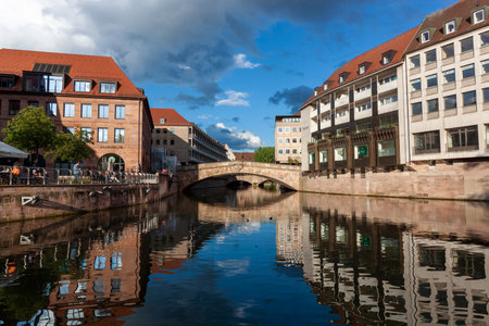 NUREMBERG, GERMANY - MAY 19, 2024: Way of living in historic center of Nuremerg near river Pegnitzのeditorial素材