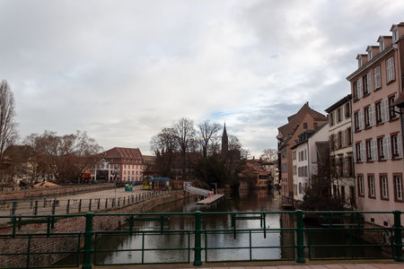 STRASBOURG, FRANCE - JANUARY 6, 2024: Bridges and old buildings on the embankment of the river Ileのeditorial素材