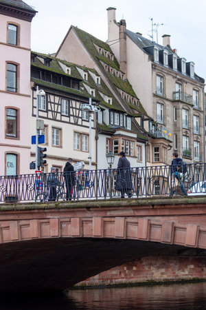 STRASBOURG, FRANCE - JANUARY 6, 2024: Bridges and old buildings on the embankment of the river Ileのeditorial素材