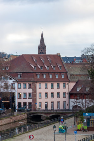 STRASBOURG, FRANCE - JANUARY 6, 2024: Bridges and old buildings on the embankment of the river Ileのeditorial素材