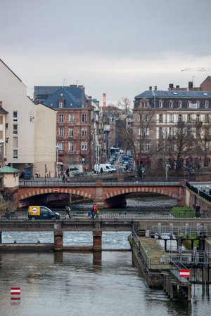 STRASBOURG, FRANCE - JANUARY 6, 2024: Bridges and old buildings on the embankment of the river Ileのeditorial素材
