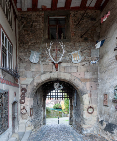 Entrance archway to the Old Castle in Bregenz, Austria, with historical decorationsの写真素材