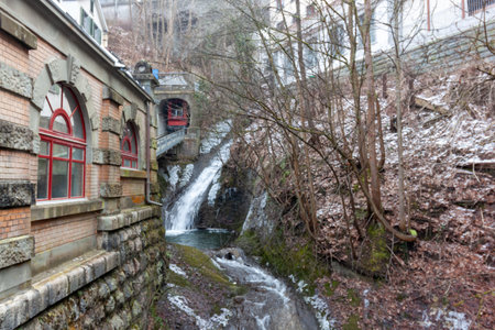 A wintery view of the MÃ¼hleggbahn funicular in St. Gallen, Switzerland, showcasing the intersection of urban infrastructure and natural beautyの写真素材