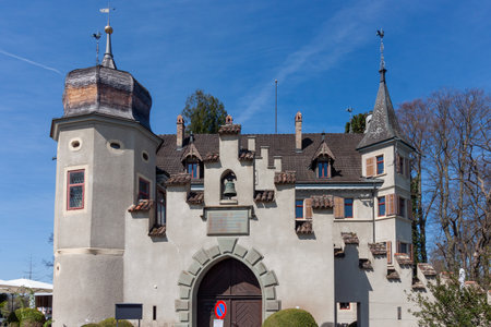 A picturesque view of Seeburg Castle in Kreuzlingen, Switzerland, standing majestically on the tranquil shores of Lake Constance (Bodensee)の写真素材