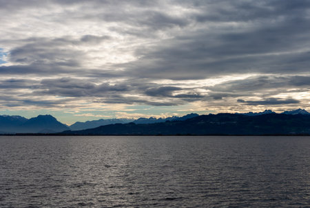 Dramatic panoramic view over the dark waters of Lake Constance (Bodensee) near Lindau, Germany, with...