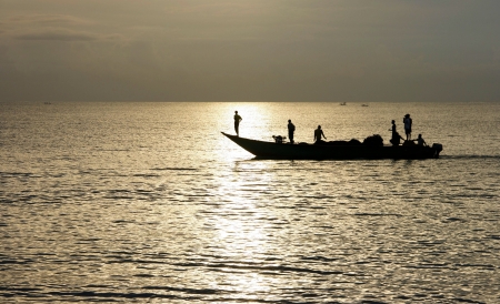 Silhouette of Lombok fishermen back from the ocean