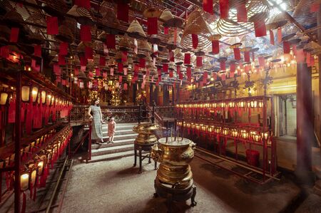 Hollywood Road, Central, Hong Kong - April 2019: Interior scene of Man Mo Temple which is the one of the most holy temple in Hong Kong.のeditorial素材