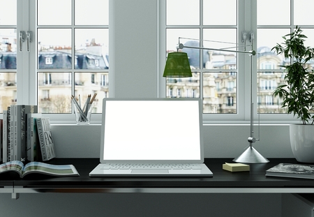 Laptop Mock-up with white Screen Stands on the Office Desk 3D Renderingの写真素材