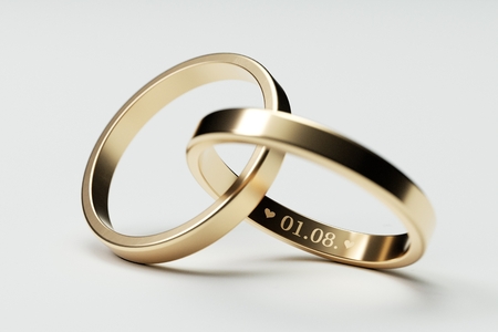 Isolated golden wedding rings with date 3D Illustrationの写真素材