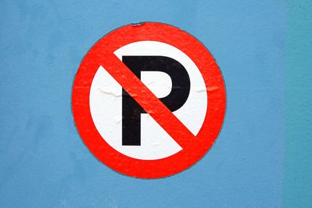 No parking sign on a blue metal backgroundの写真素材