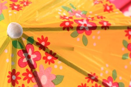 Colorful paper cocktail umbrella or parasole with flower designの写真素材