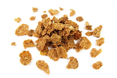 Wholegrain corn flakes isolated on white background 