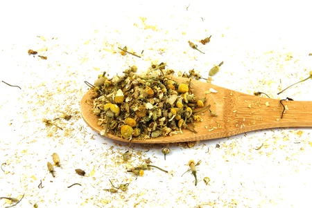 Dry chamomile with wood spoonの写真素材