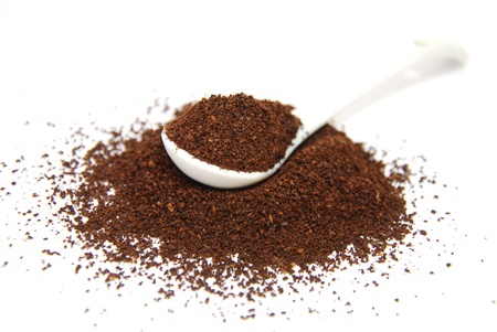 Coffee with spoon on white background の写真素材