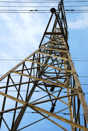 power pole with blue sky background and white cloudsの写真素材