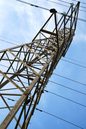 power pole with blue sky background and white cloudsの写真素材