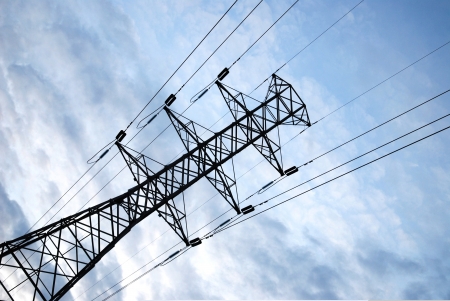 power pole with blue sky background and white cloudsの写真素材