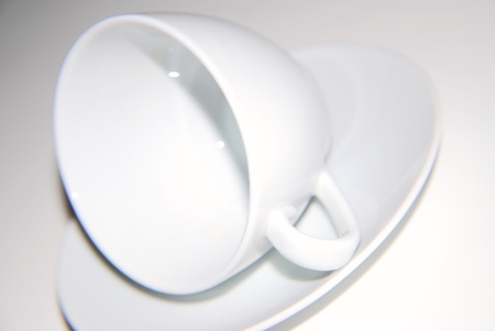Clean plates and cups isolated on whiteの写真素材