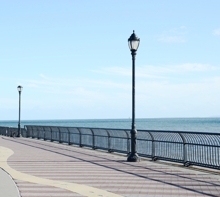 Lamp post on the oceanの写真素材