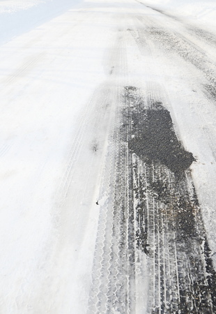 Tire tracks in snowの写真素材