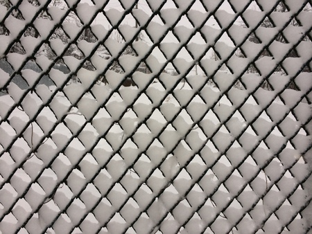 Wire fence with snowの写真素材