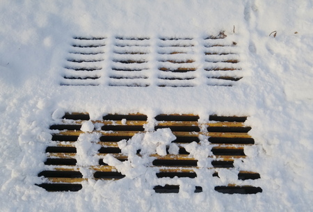 manhole with snowの写真素材