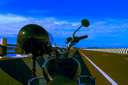 Motorcycle parked on the road with blue sky background, India