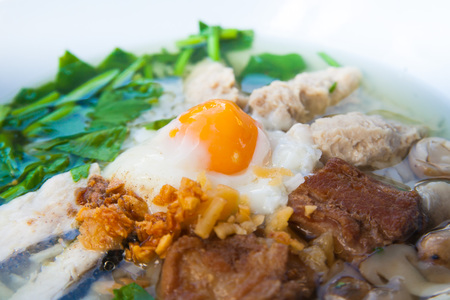 Rice soup with minced pork in the morning