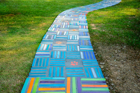 Ceramic tailes colors for walkway on lawn grassの写真素材