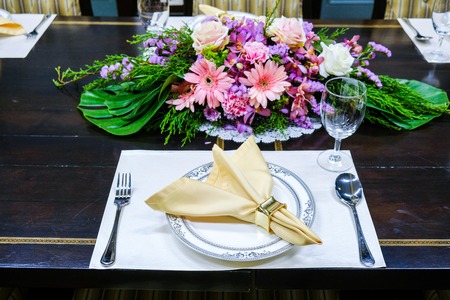 Empty glasses set in restaurant on yellow themesの写真素材