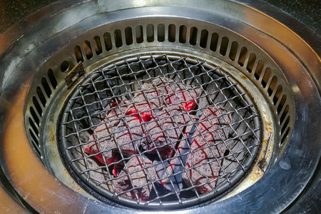 The stove barbecue and hot charcoal in restaurantの写真素材