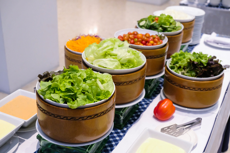 Salad bar and sauce on table for partyの写真素材