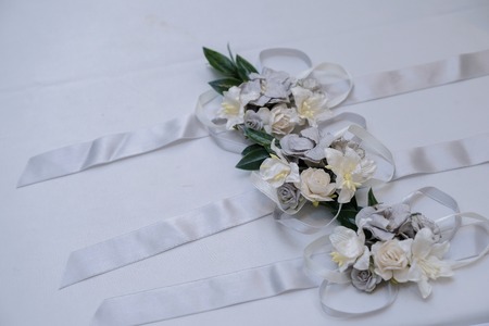 Little  flower bouquet  and ribbon on white tableの写真素材