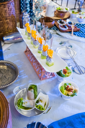 Mixed Fruit and dessert on white  plate in partyの写真素材