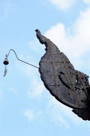 Ornaments enshrined on the roof of an old Buddhist templeの写真素材