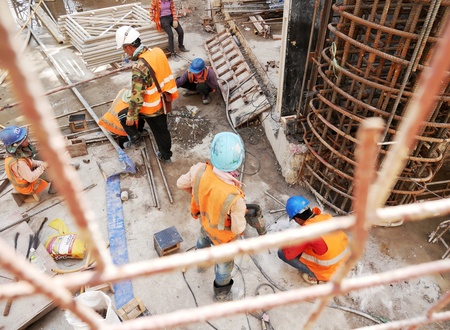 Backside of workers at construction site,Laosの素材