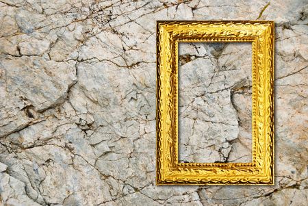 Gold frame on a stone backgroundの写真素材