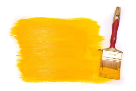 Brush with yellow paint on the white backgroundの写真素材