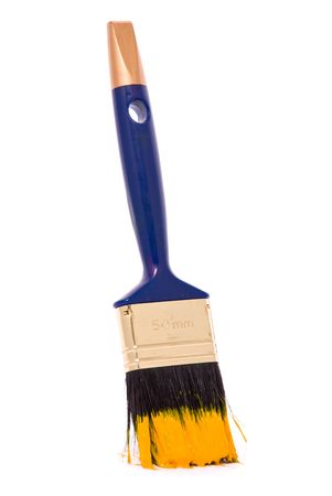 Professional brush with yellow paint on a white backgroundの写真素材