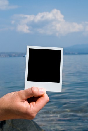 Photo card in handの写真素材